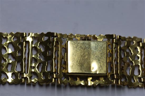 A ladys 18ct gold bracelet wristwatch by John Donald, circa 1970, with Corun movement (bracelet marked JAD) 15.2cm.